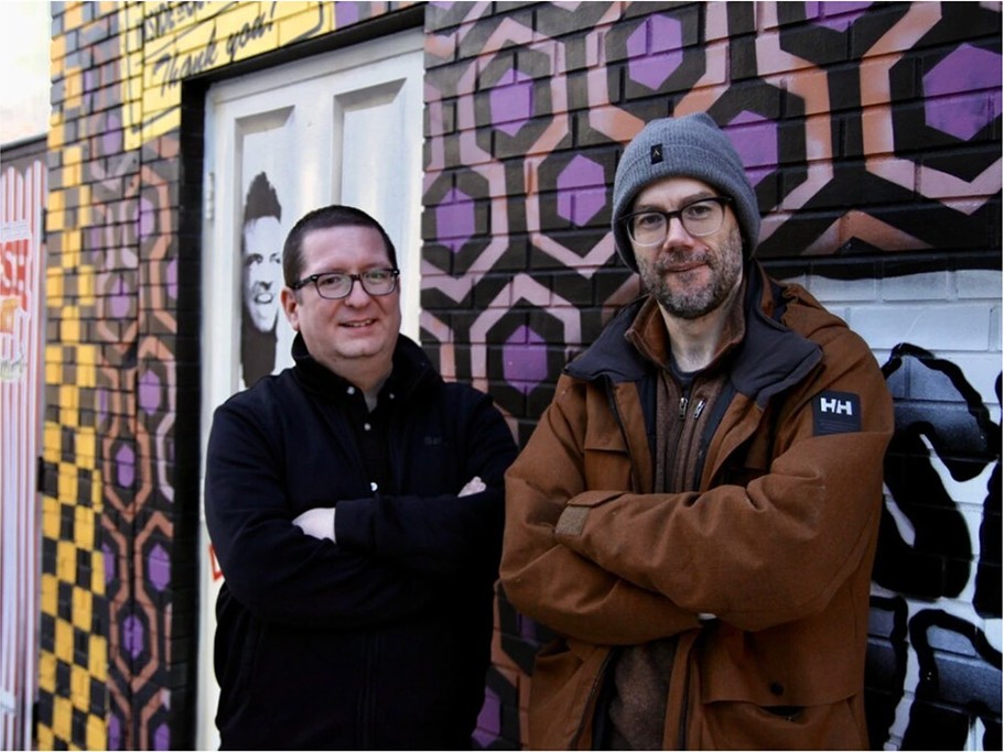 Two Windsor Film Society founders standing in WIFF Alley.